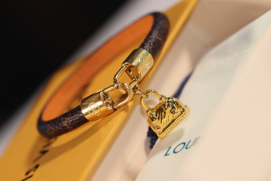 LV ALMA PINK GOLD CANVAS