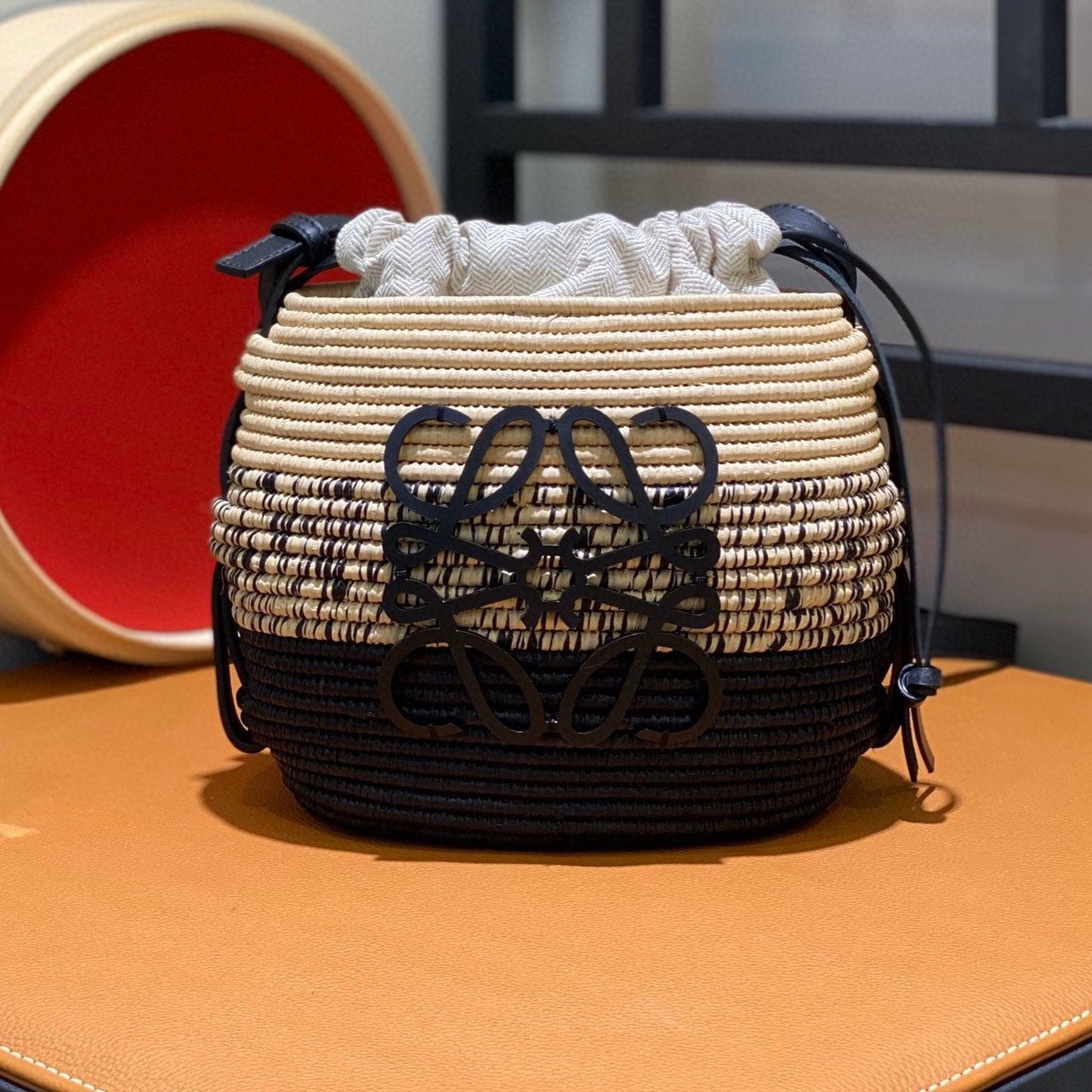 LOE 18 ANAGRAM BASKET BAG IN BLACK AND NATURAL RAFFIA