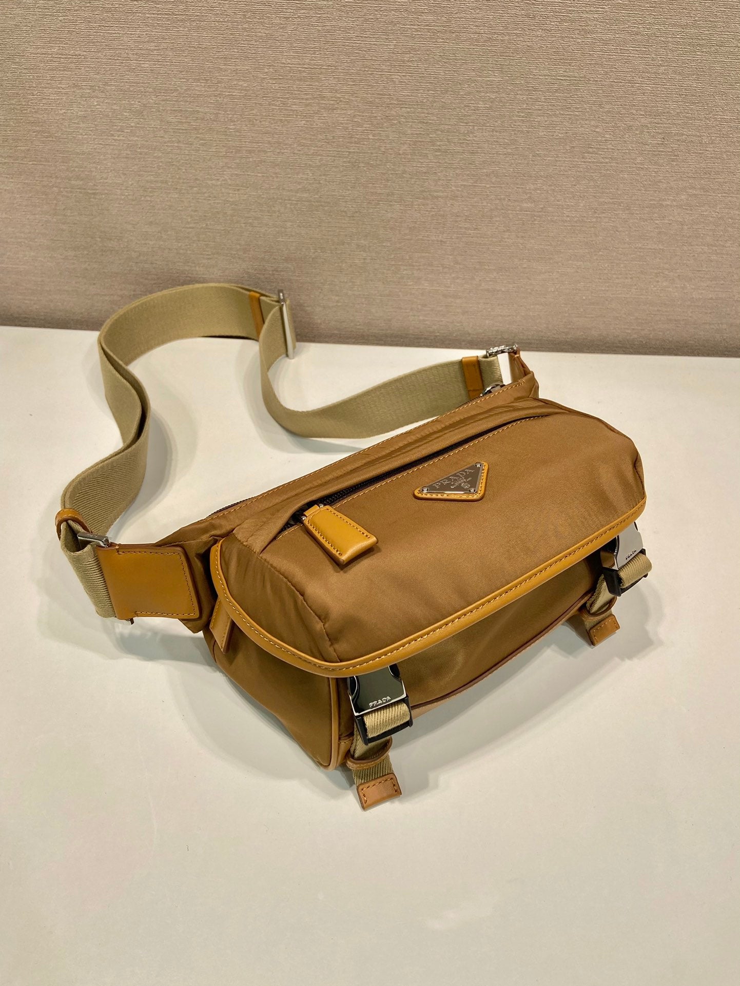 MESSENGER BAG 20 IN CIDER BROWN RE-NYLON AND CALFSKIN TRIM
