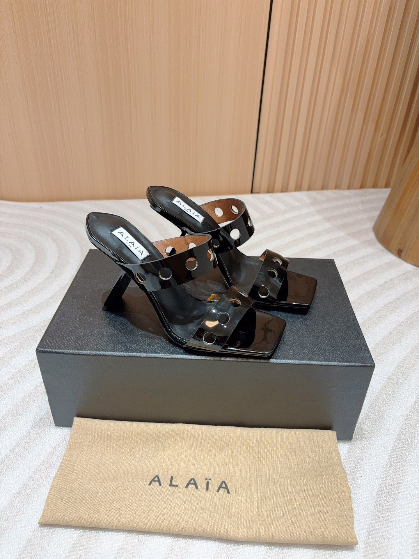 ALAIA TWO-STRAPS HIGH HEEL SANDALS IN BLACK PATENT LAMBSKIN