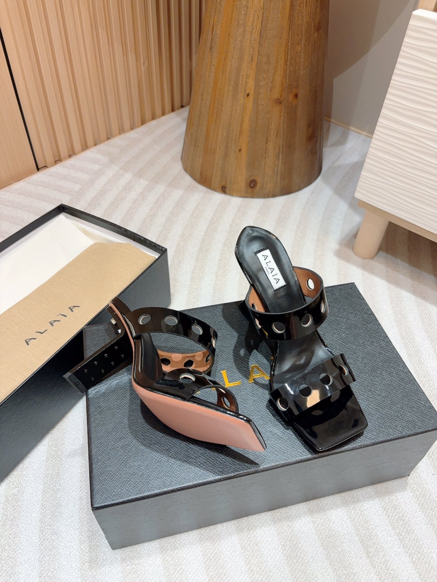 ALAIA TWO-STRAPS HIGH HEEL SANDALS IN BLACK PATENT LAMBSKIN