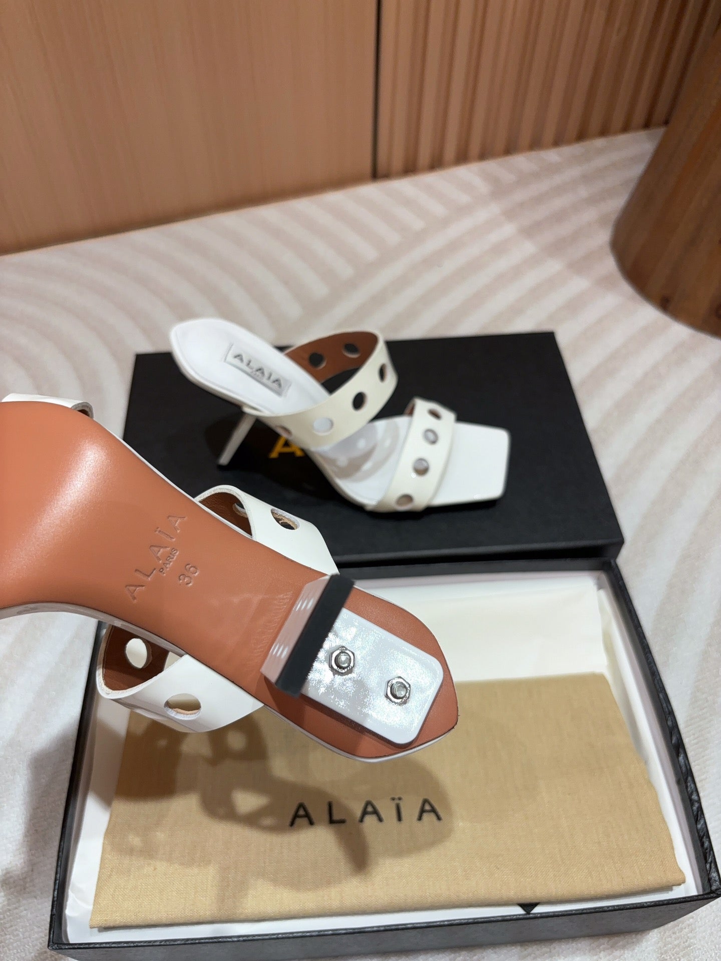 ALAIA TWO-STRAPS HIGH HEEL SANDALS IN WHITE PATENT LAMBSKIN