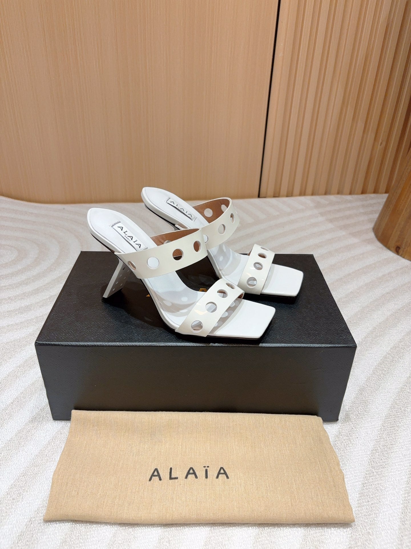 ALAIA TWO-STRAPS HIGH HEEL SANDALS IN WHITE PATENT LAMBSKIN