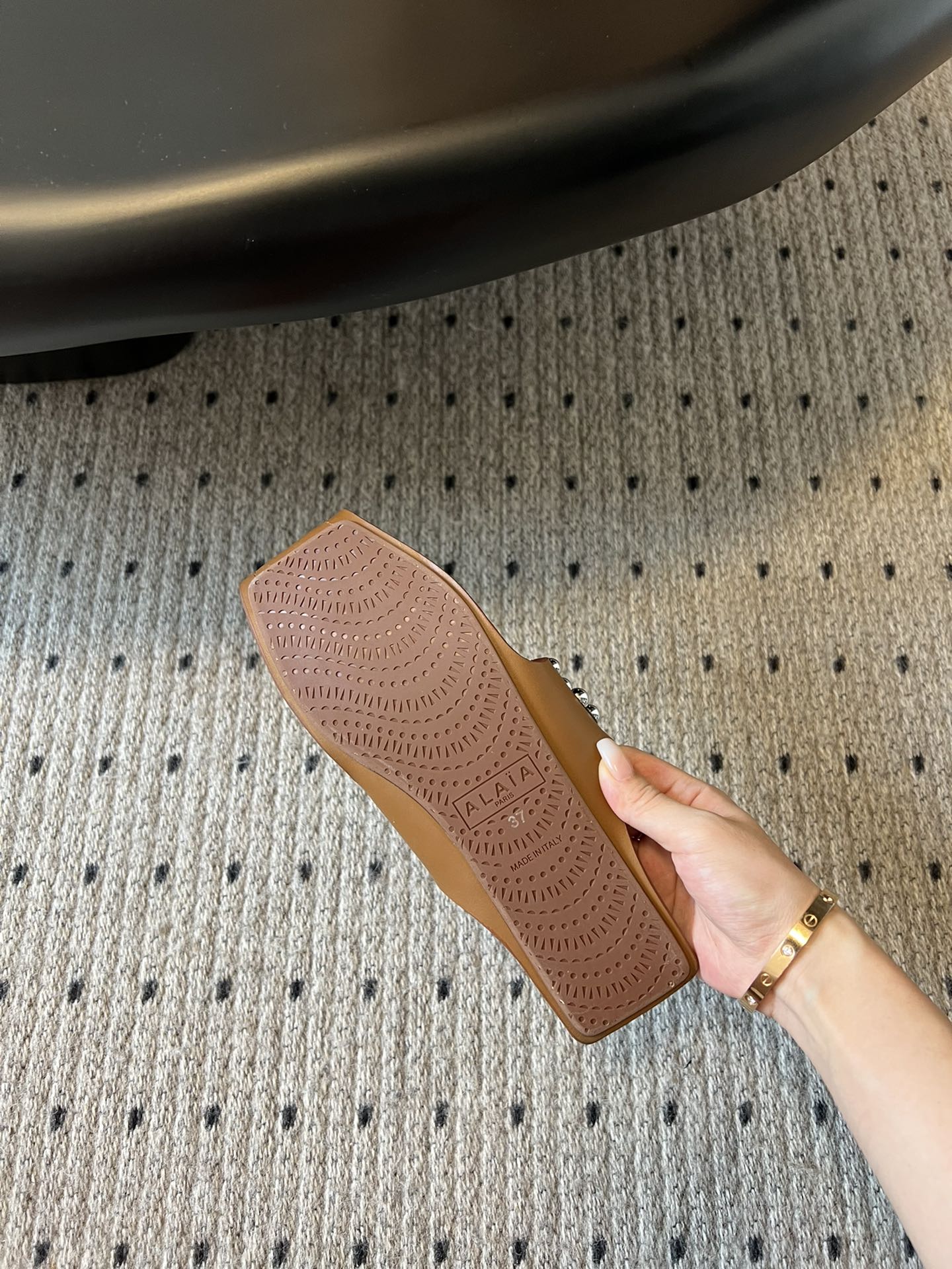 ALAIA FOLDED FLAT MULES WITH SPHERES ON COPPER BROWN CALFSKIN