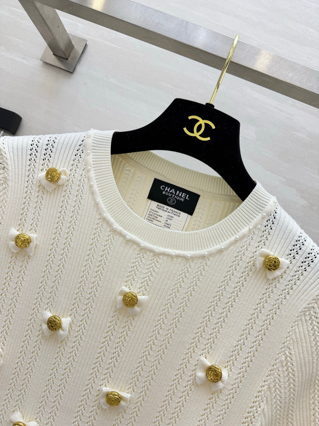 Chanel 2026 Gold Button Bow Short-sleeve Top Cream Cotton 394202