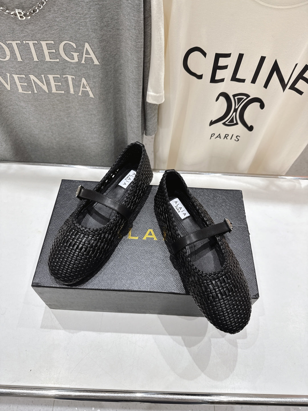 ALAIA MARY JANE FLATS black woven calfskin pattent