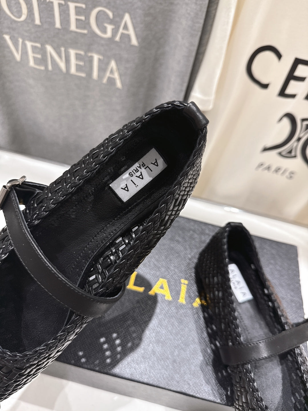 ALAIA MARY JANE FLATS black woven calfskin pattent