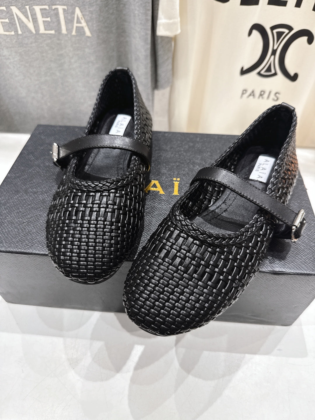 ALAIA MARY JANE FLATS black woven calfskin pattent