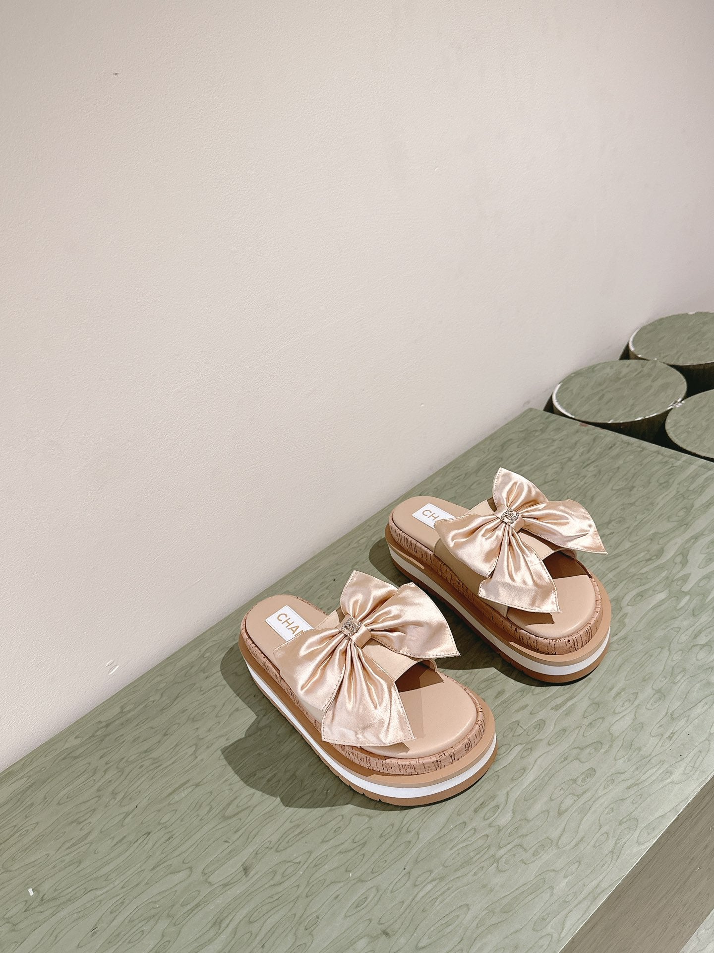 CC SLIPPERS WITH SILK BOW IN BEIGE ALMOND COWHIDE