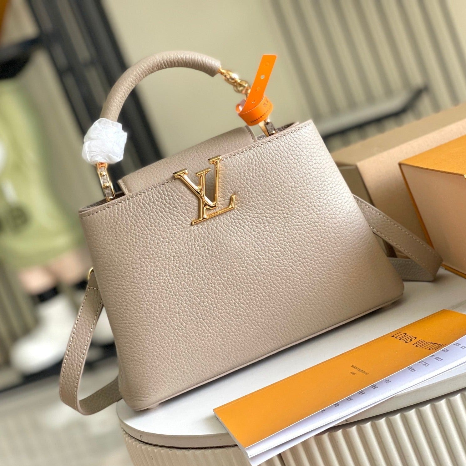 CAPUCINES BB 27 DARK BEIGE TAURILLON GOLD HARDWARE