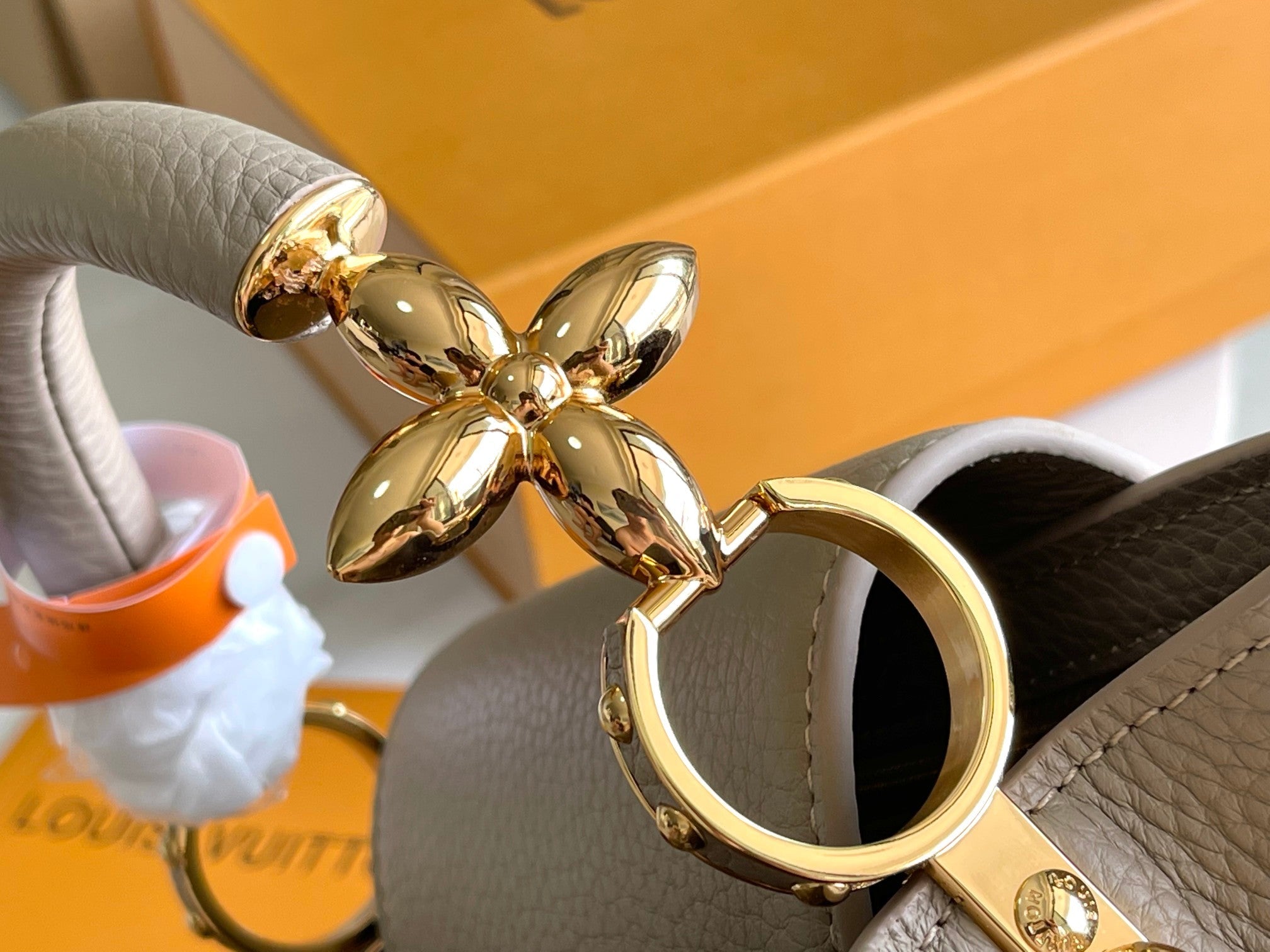 CAPUCINES BB 27 DARK BEIGE TAURILLON GOLD HARDWARE