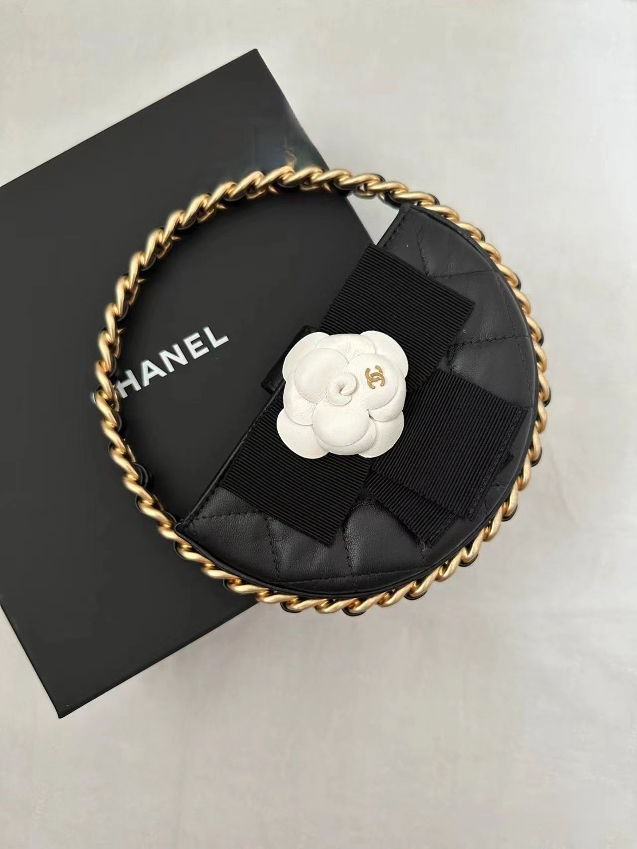 Chanel 2026 Quilted Round Camellia Mini Clutch 16cm Lambskin