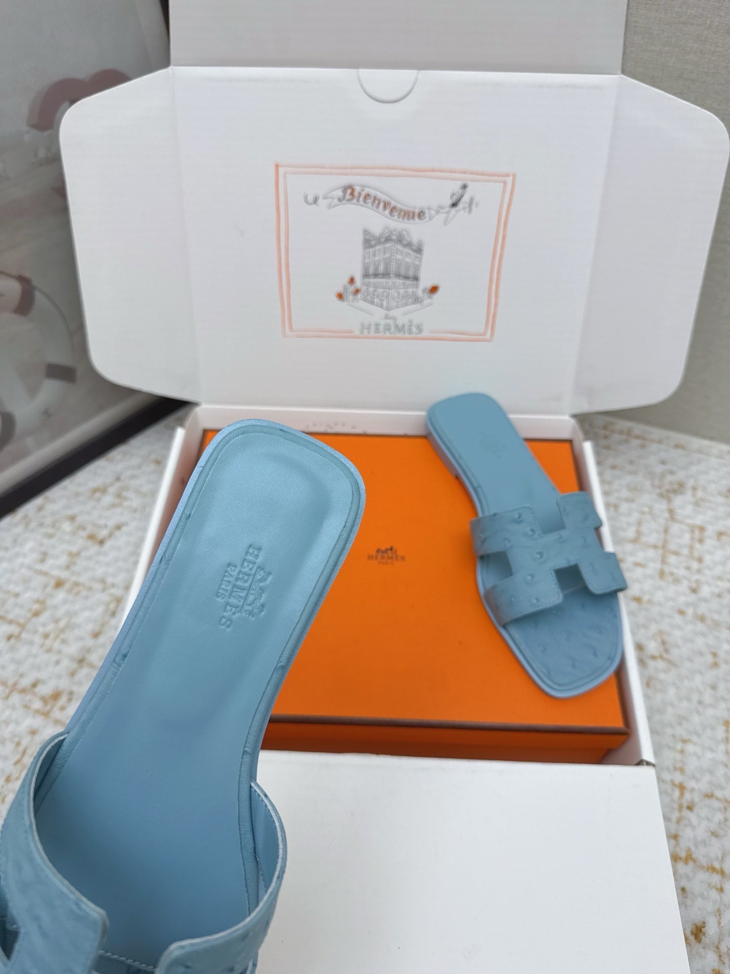 HM 26ss Oran Sandals Light Blue Ostrich Leather 625103