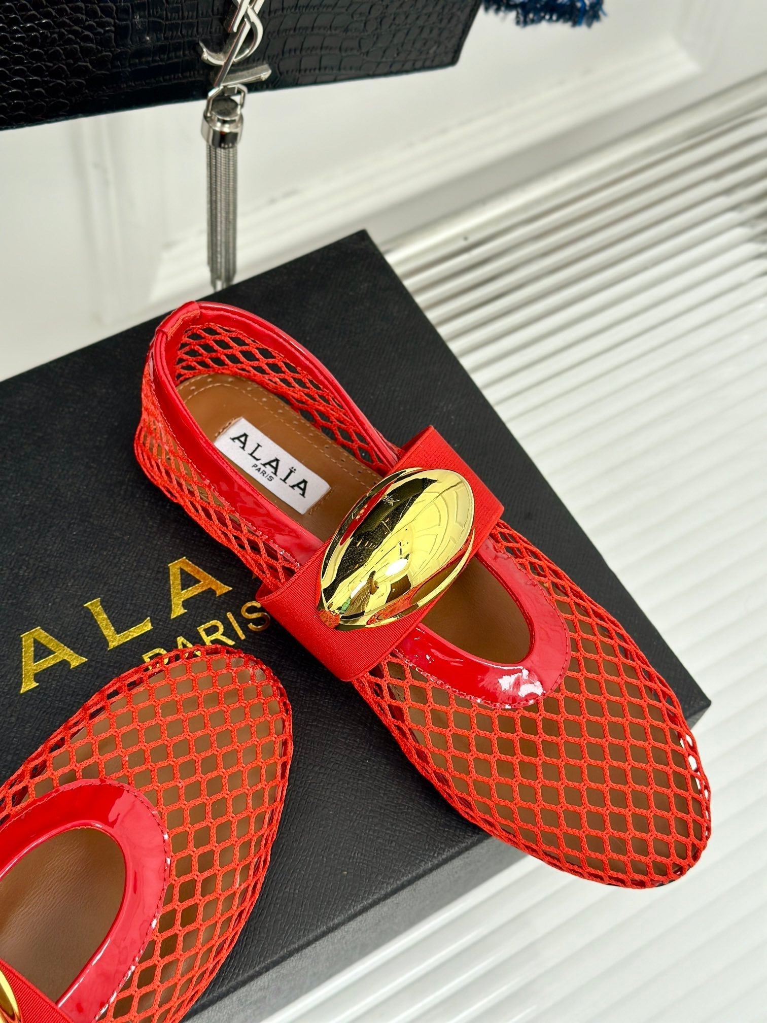 ALAIA MARY JANE SHOES IN CHERRY RED MESH WITH GOLD HARDWARE