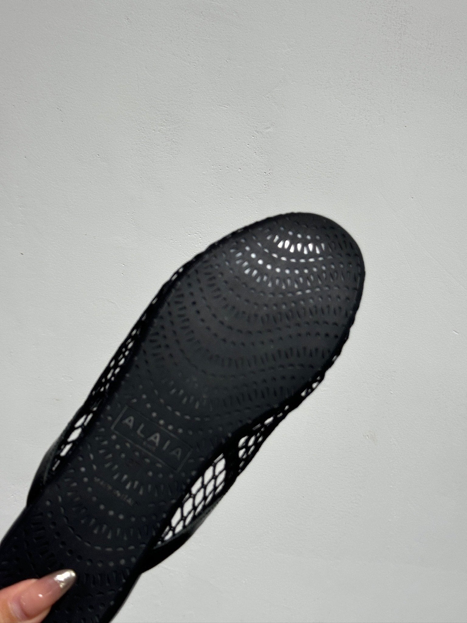 ALAIA FLAT MULES IN BLACK MESH FISHNET