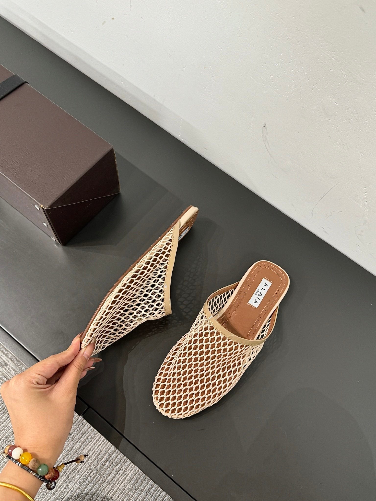 ALAIA FLAT MULES IN BEIGE MESH FISHNET