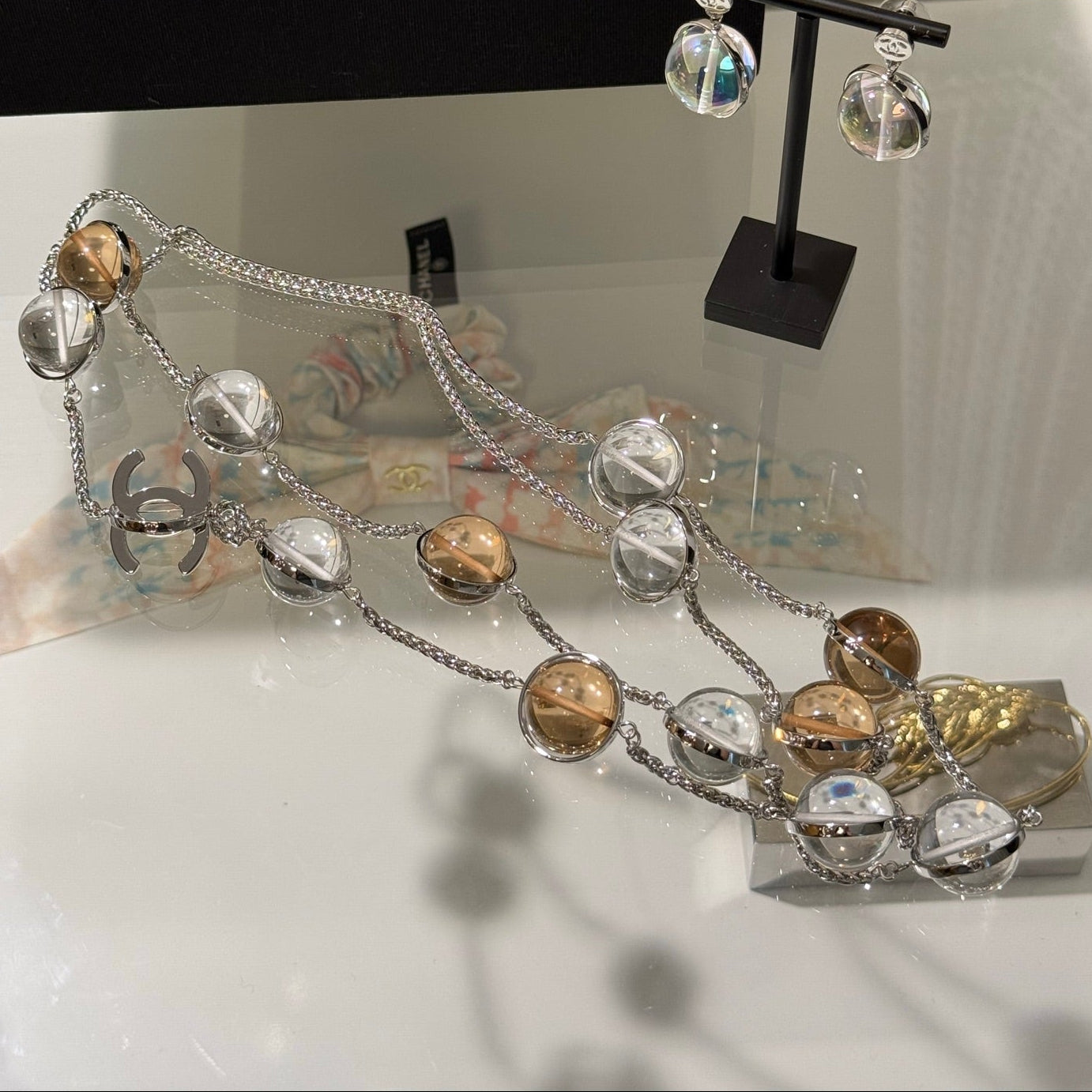 Chanel 2026 Transparent Crystal Ball Planet Silver Double C Long Necklace