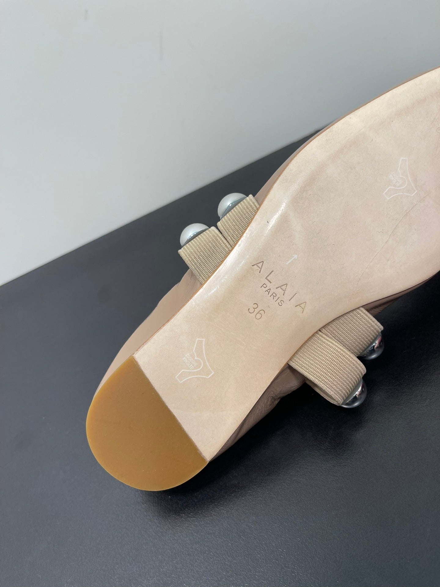 ALAIA BALLET FLATS IN ALMOND BEIGE GLOSSY CALFSKIN WITH SILVER HARDWARE