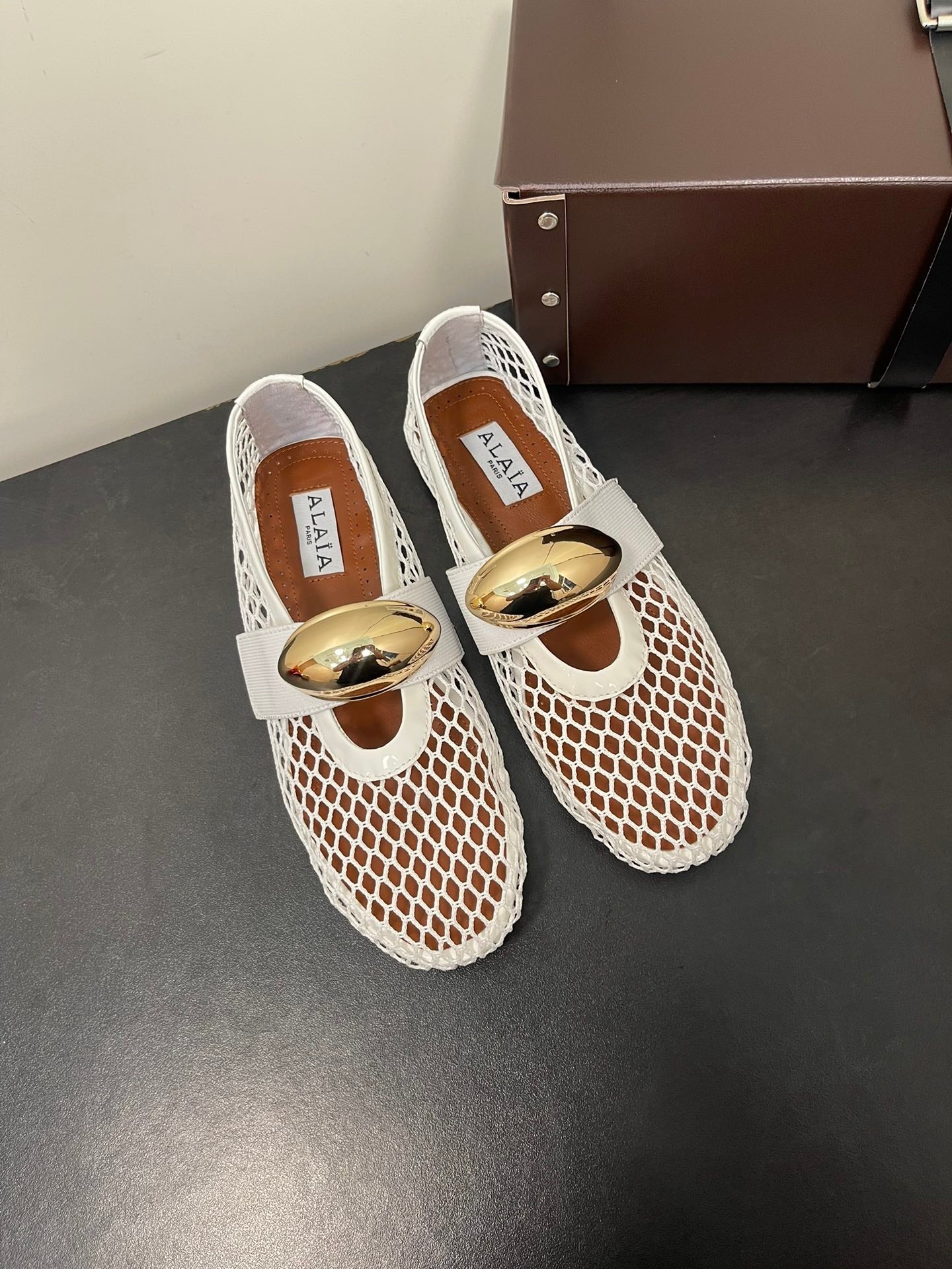 ALAIA BALLET FLATS IN WHITE MESH FISHNET WITH GOLD HARDWARE