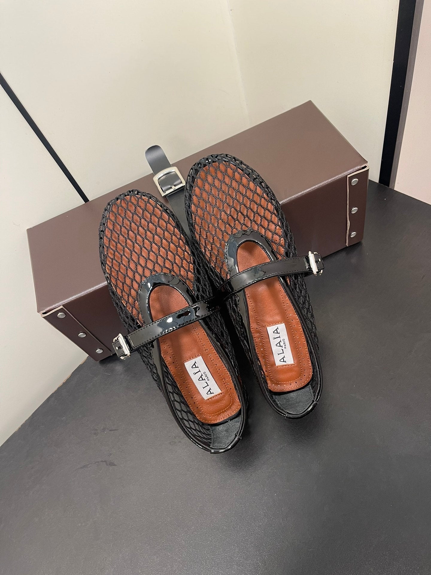 ALAIA BALLET FLATS IN BLACK MESH FISHNET