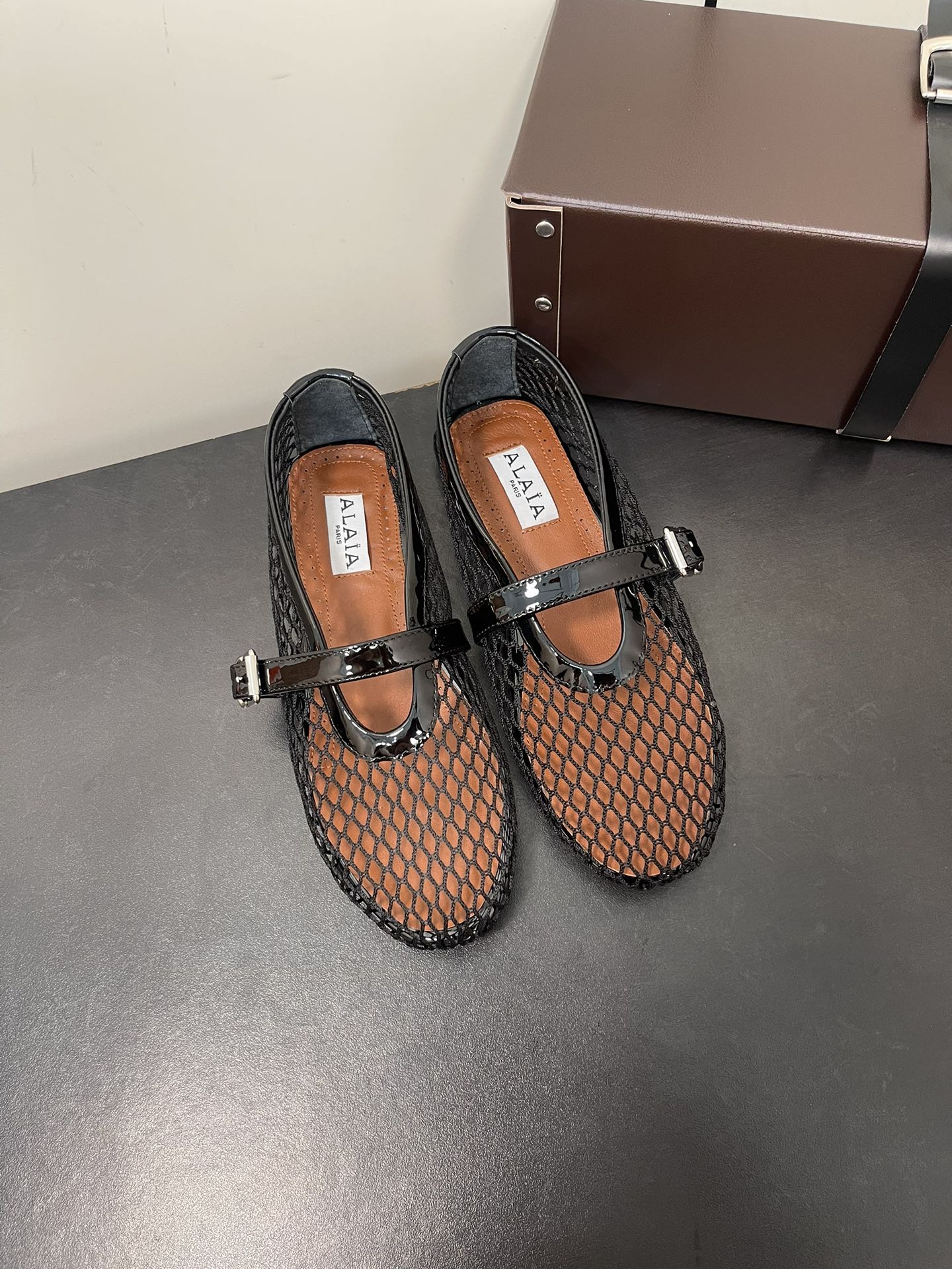 ALAIA BALLET FLATS IN BLACK MESH FISHNET