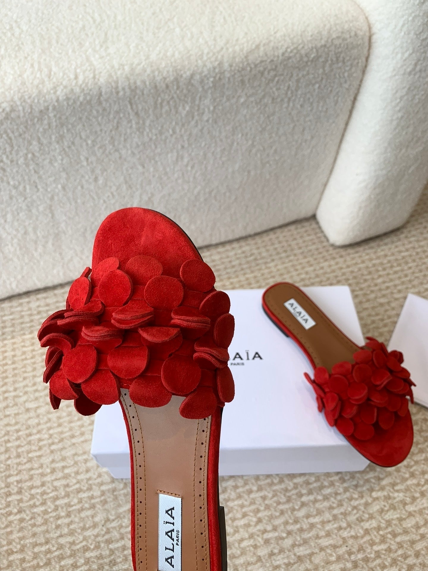 ALAIA FLAT MULE IN CHERRY RED SUEDE