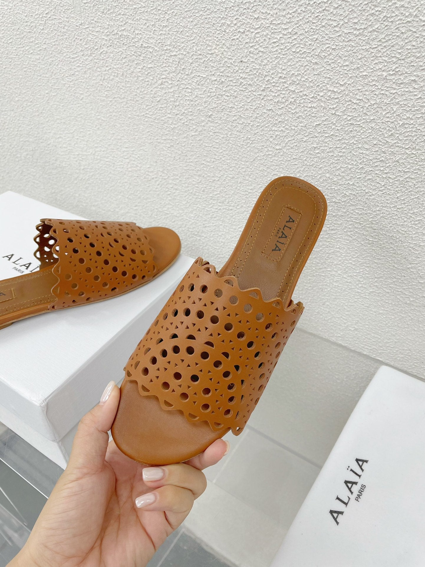 ALAIA VIENNE FLAT MULES IN CHOCOLATE BROWN LAMBSKIN