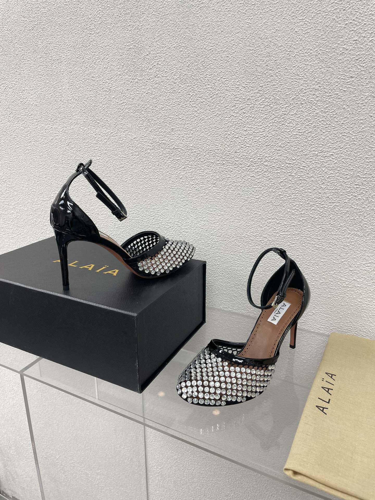 ALAIA HIGH FISHNET PUMPS IN BLACK MESH WITH WHITE RHINSTONES