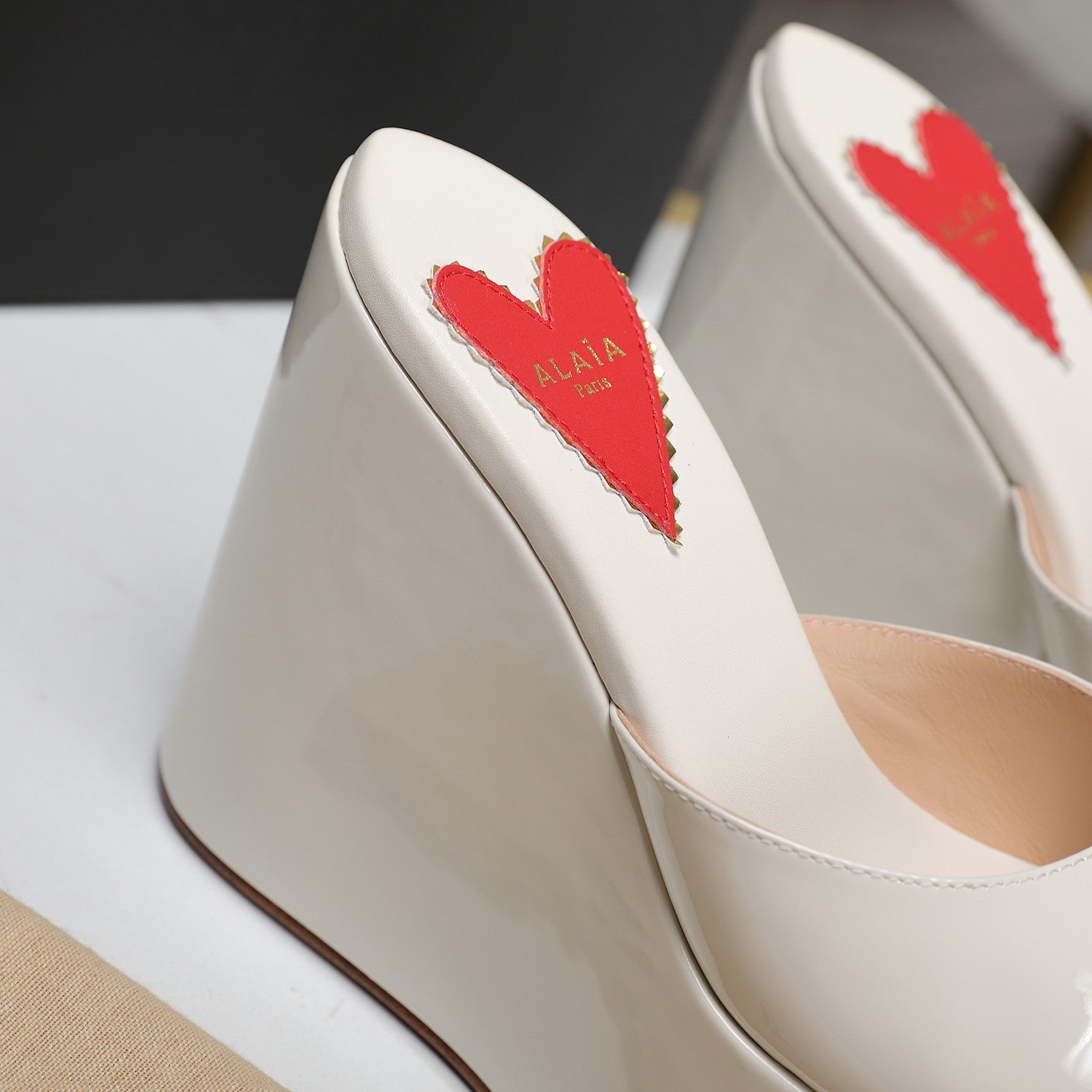 ALAIA PLATFORM WEDGE IN WHITE TAN LAMBSKIN WITH RED HEART