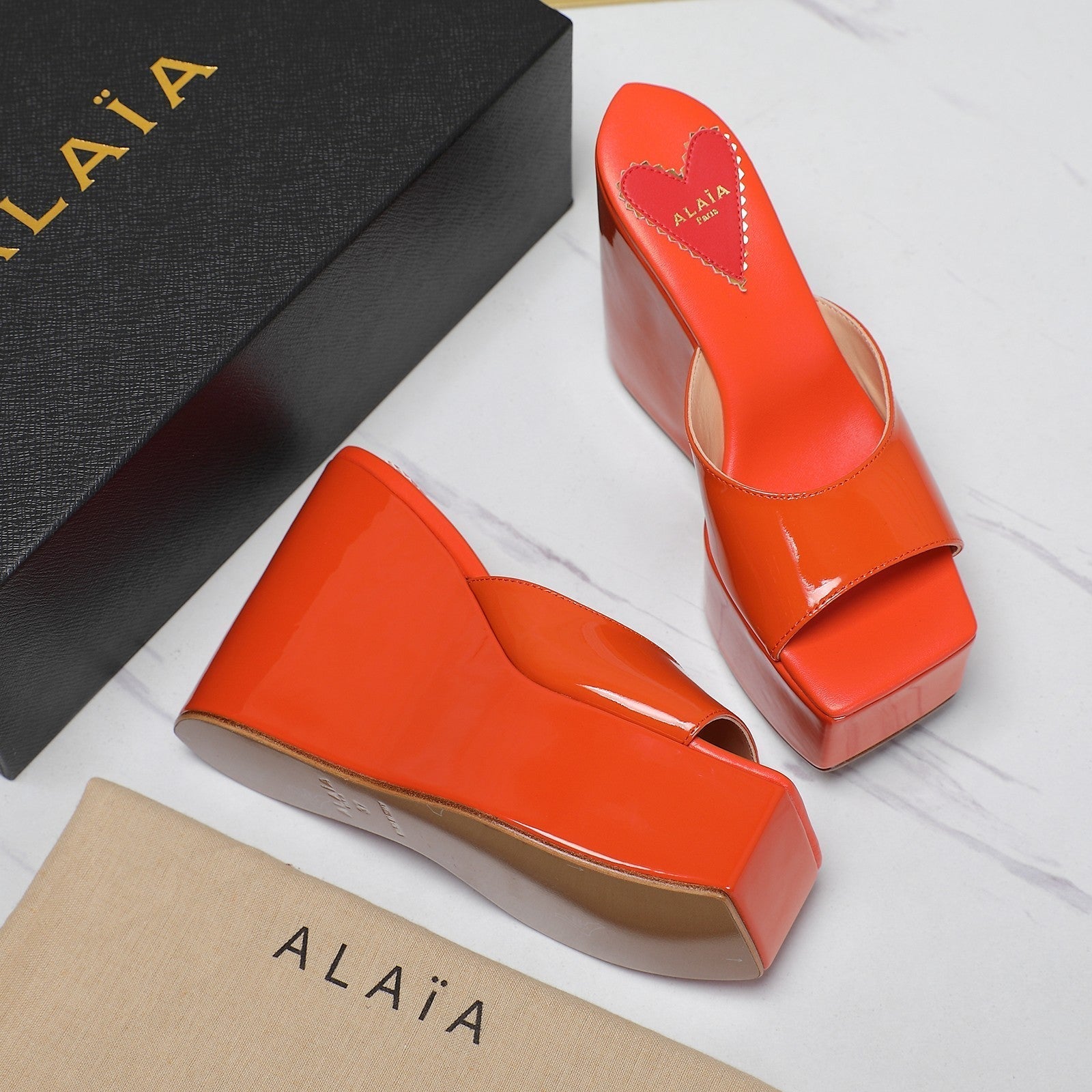 ALAIA PLATFORM WEDGE IN VIVID ORANGE LAMBSKIN WITH RED HEART