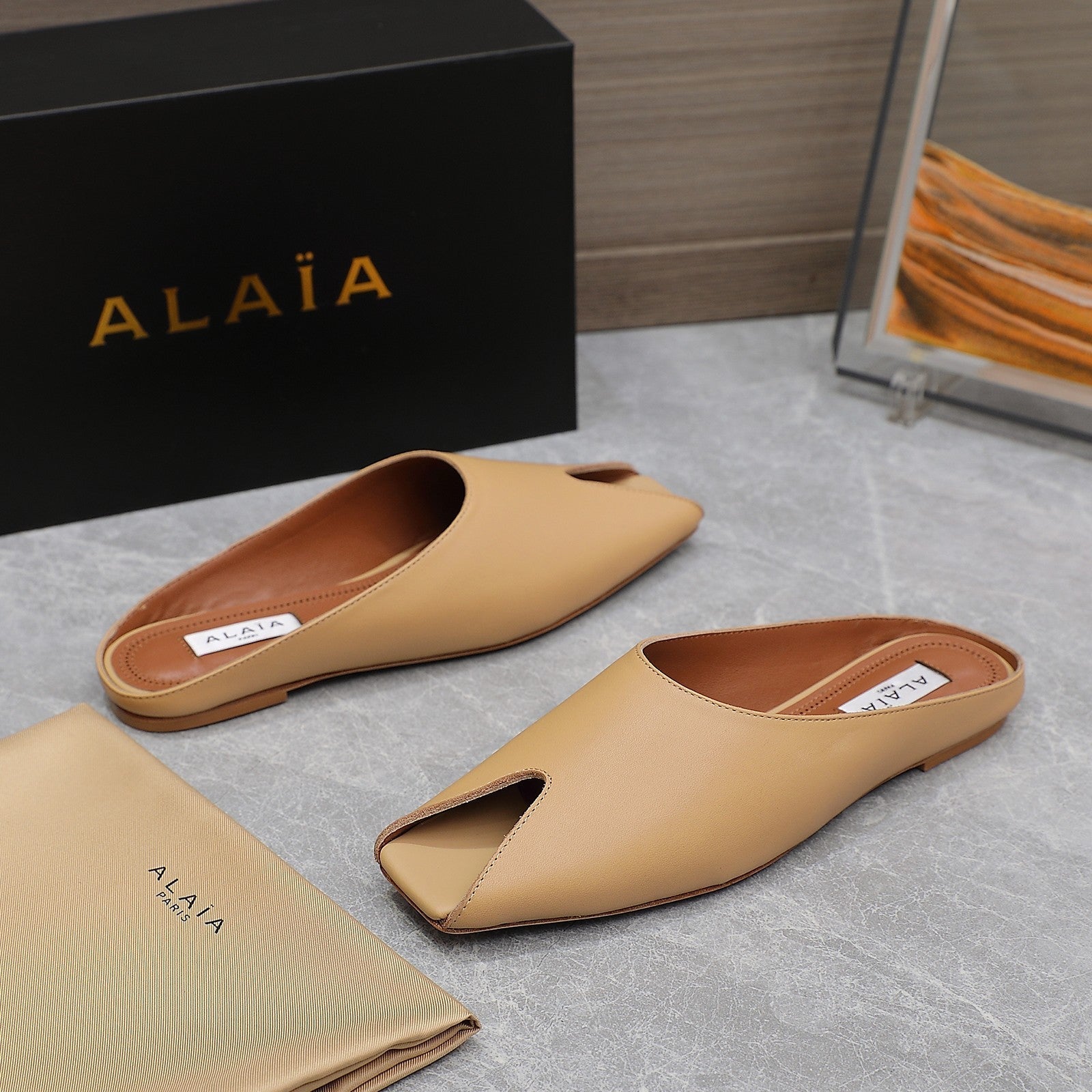 ALAIA FLAT MULE IN SEPIA TAN LAMBSKIN