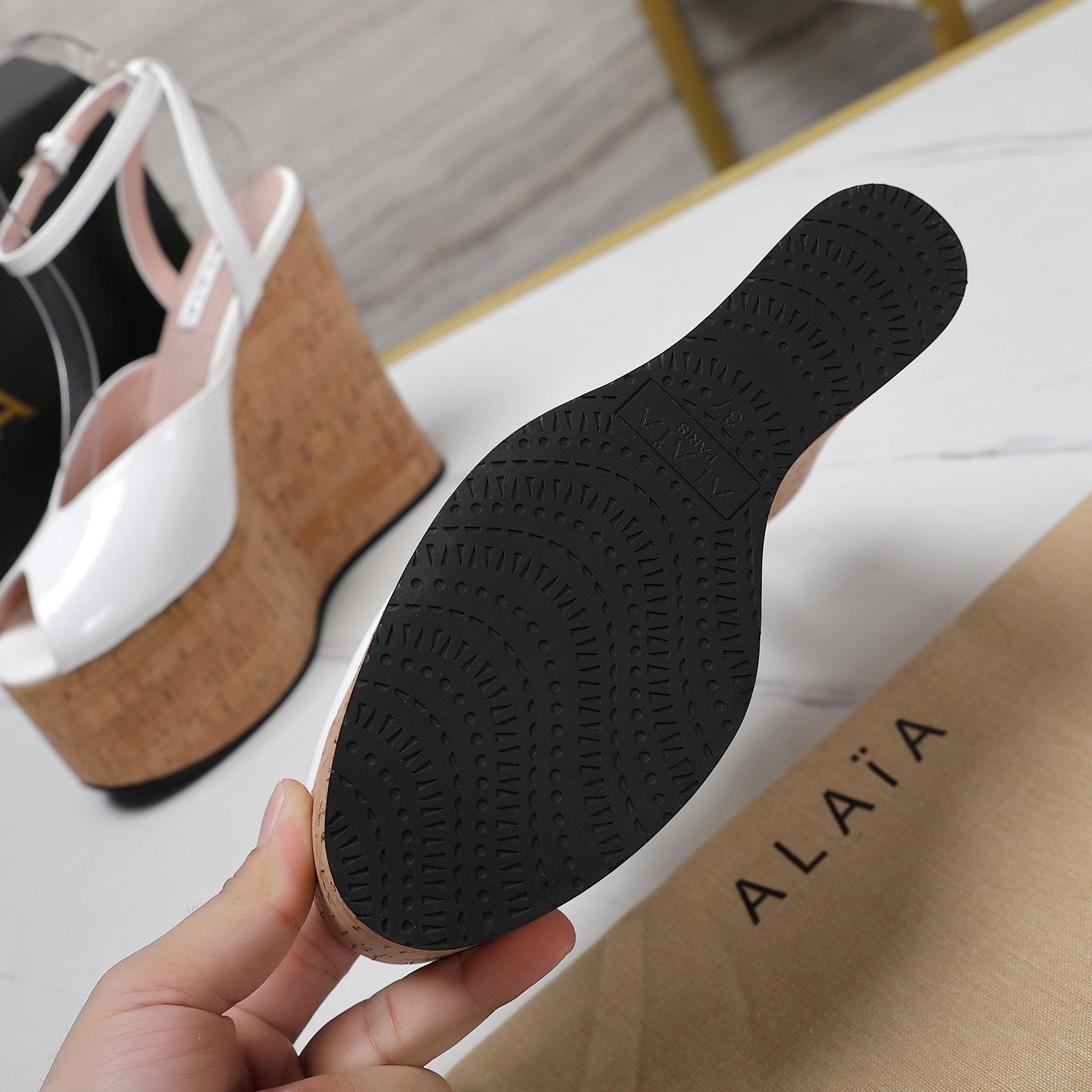 ALAIA WEDGE SANDAL IN WHITE GLOSSY CALFSKIN AND BEIGE RUBBER