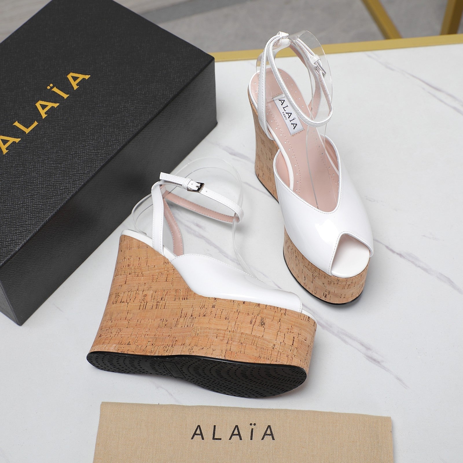 ALAIA WEDGE SANDAL IN WHITE GLOSSY CALFSKIN AND BEIGE RUBBER