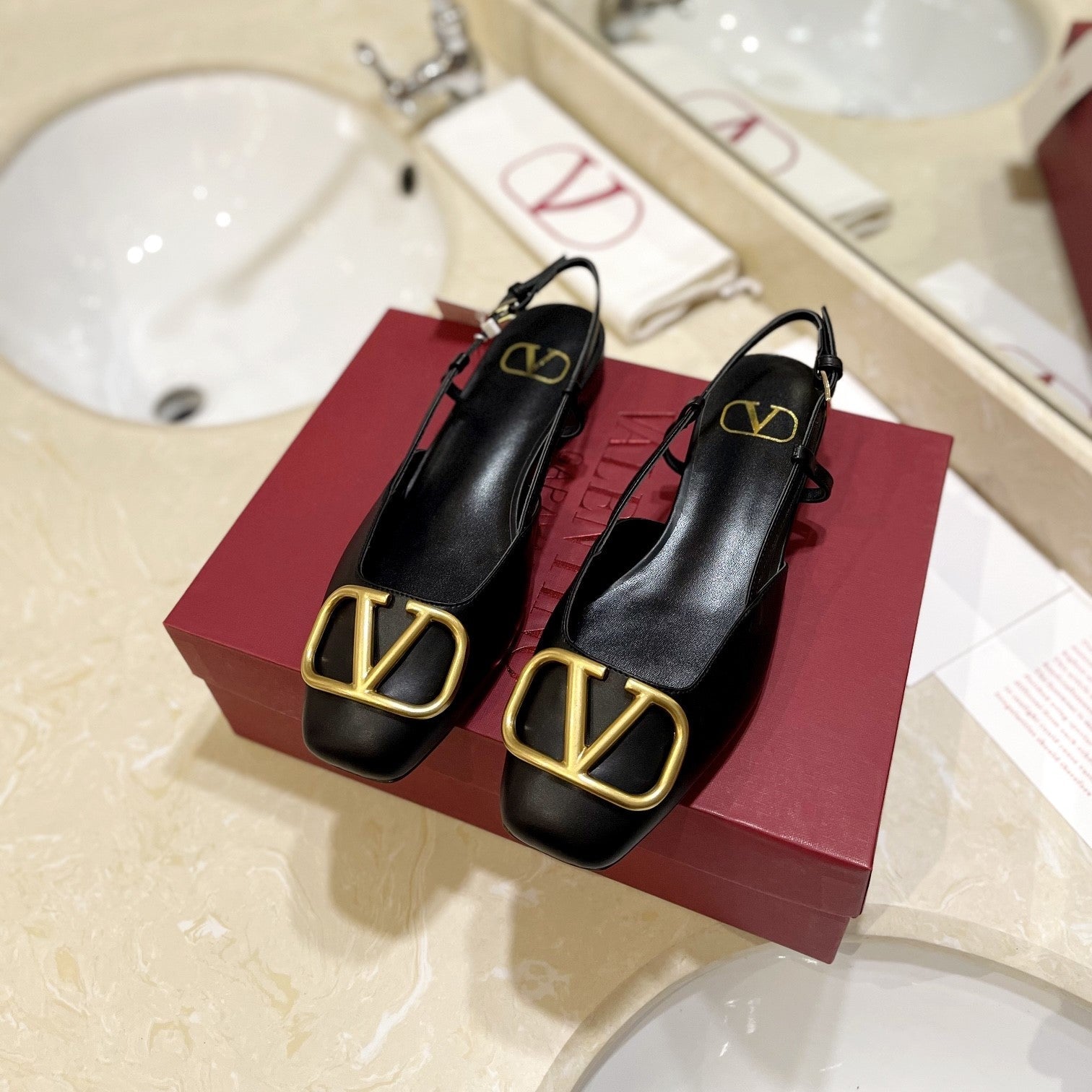 VLOGO BLACK LEATHER SLINGBACK FLATS