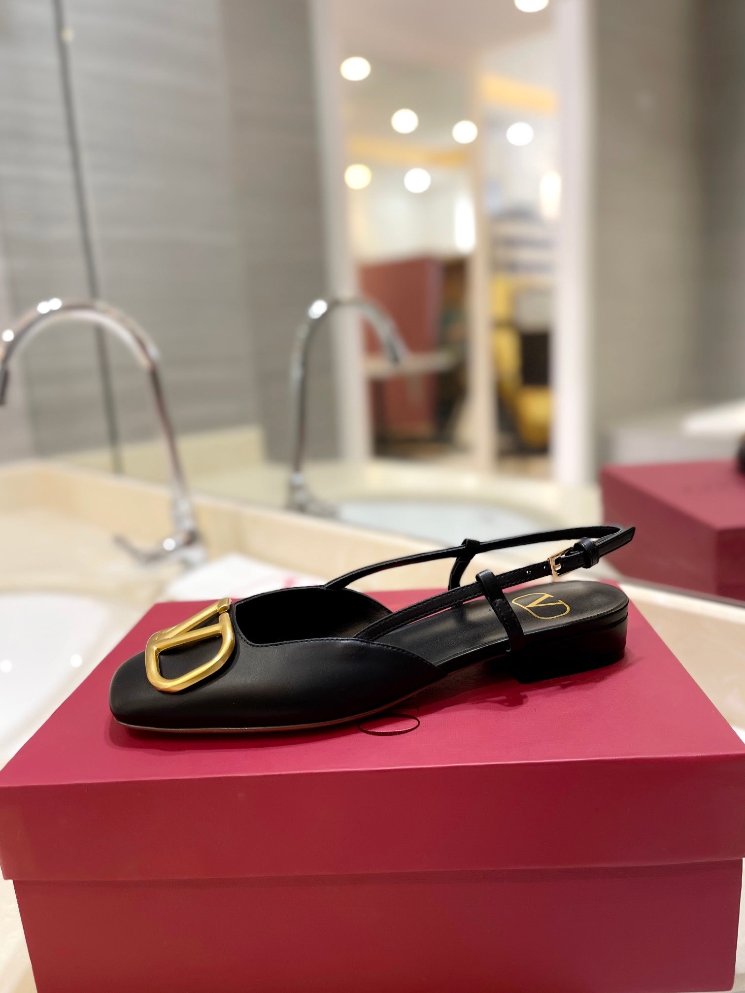 VLOGO BLACK LEATHER SLINGBACK FLATS