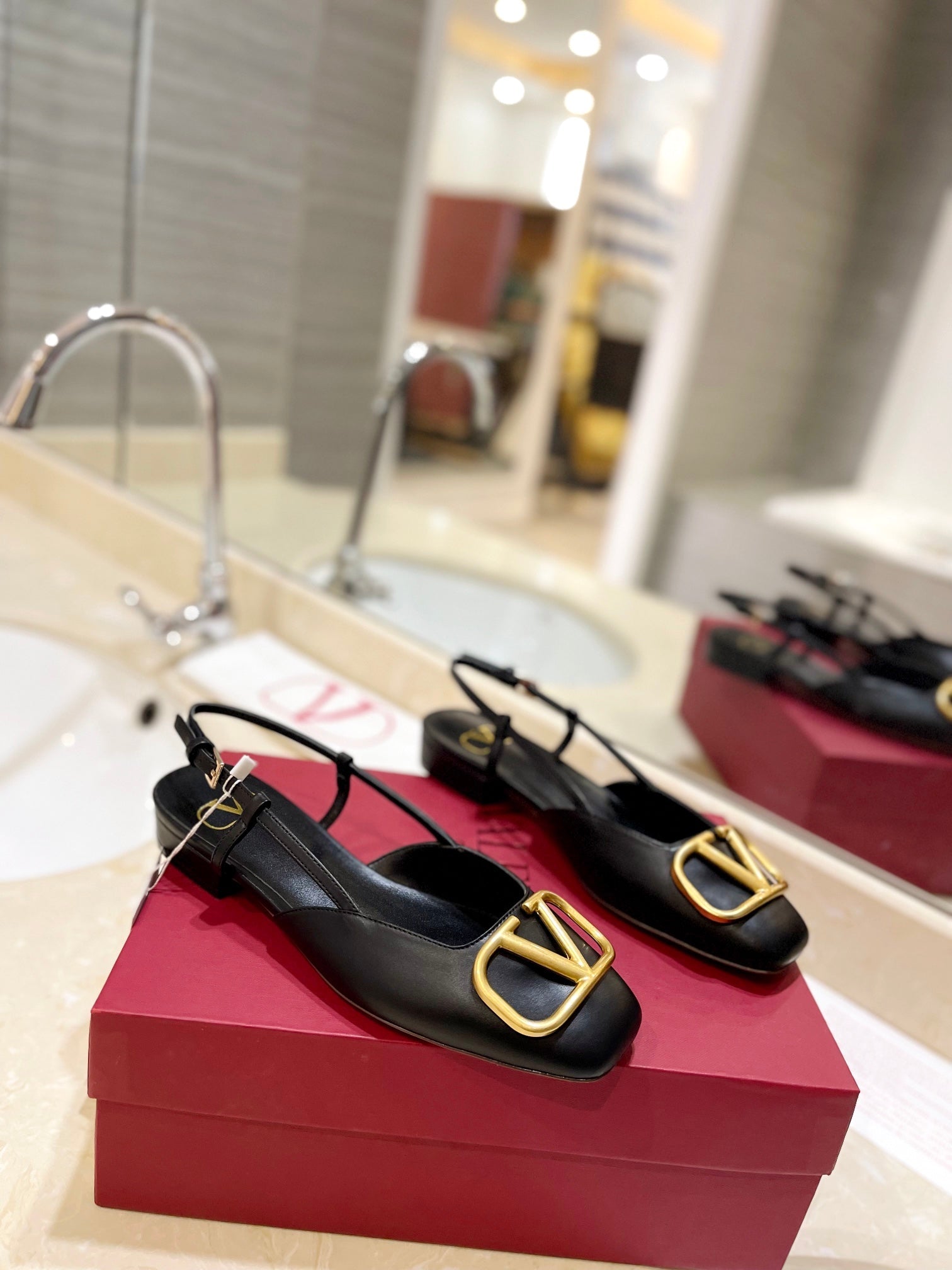 VLOGO BLACK LEATHER SLINGBACK FLATS